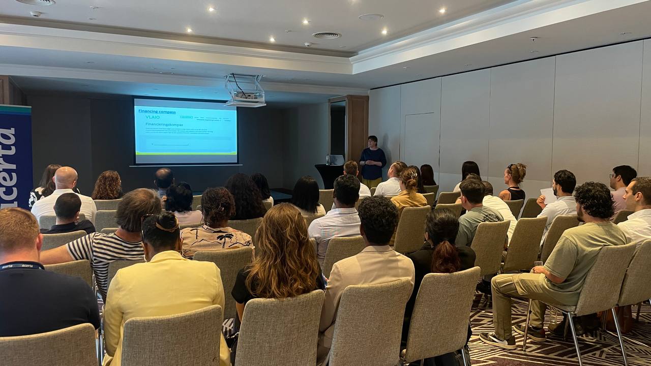 Group of people attending a presentation in a conference room